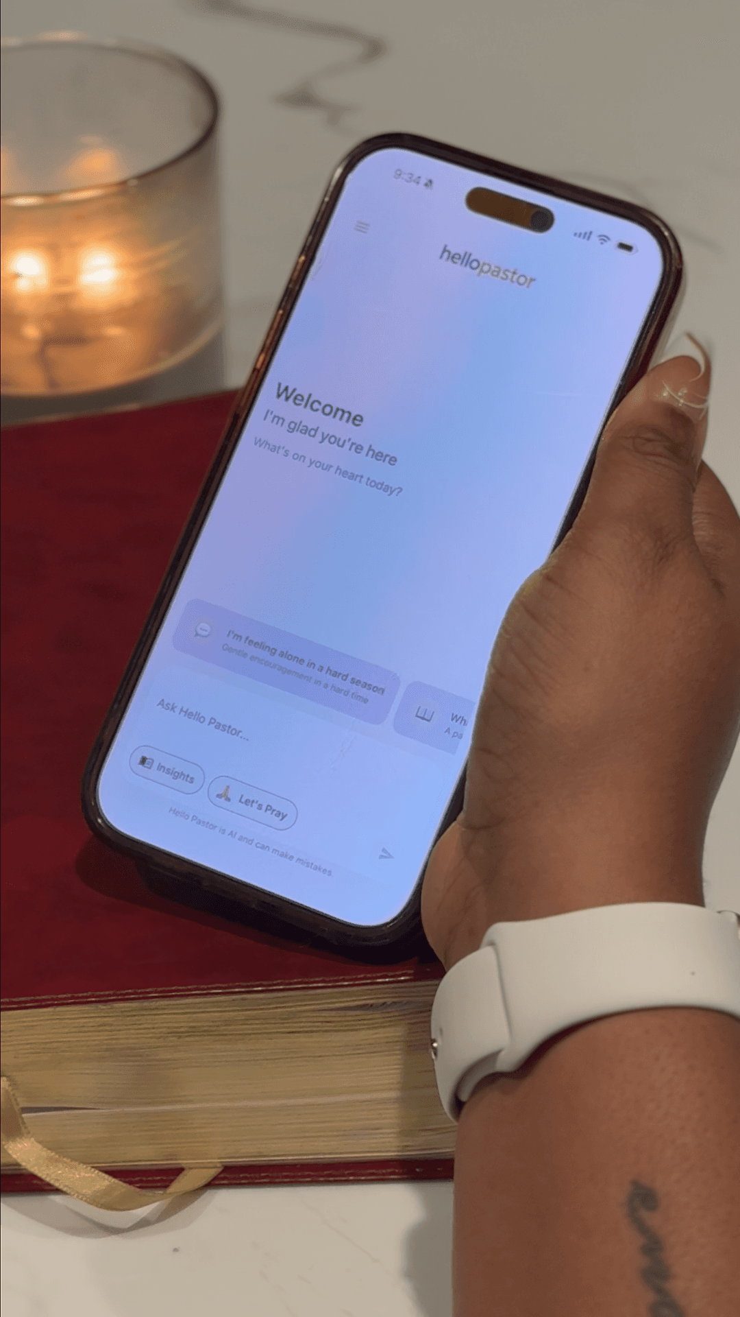 Someone holding a phone with Hello Pastor open beside Scripture
